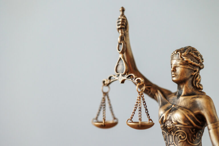 the symbol of justice and justice is a statuette of the goddess Themis judge's gavel
