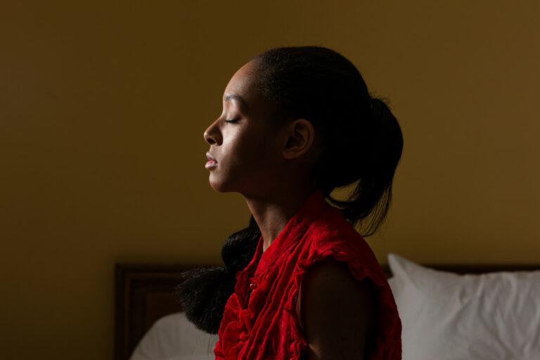 Side view of young woman with eyes closed